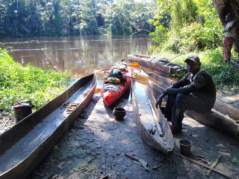 P20 Our Excursion kayak fraternising once again with Congolese pirogues..jpg